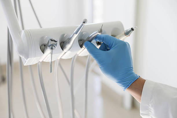 Professional Tooth Extraction technician working in St. Johns, MI